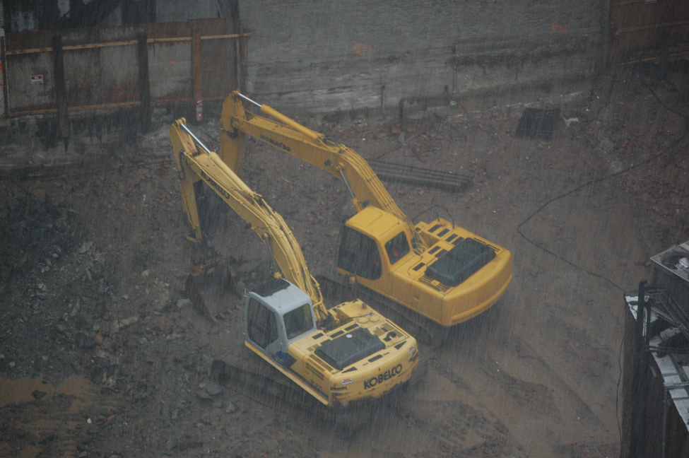 Backhoes in rain.bwc