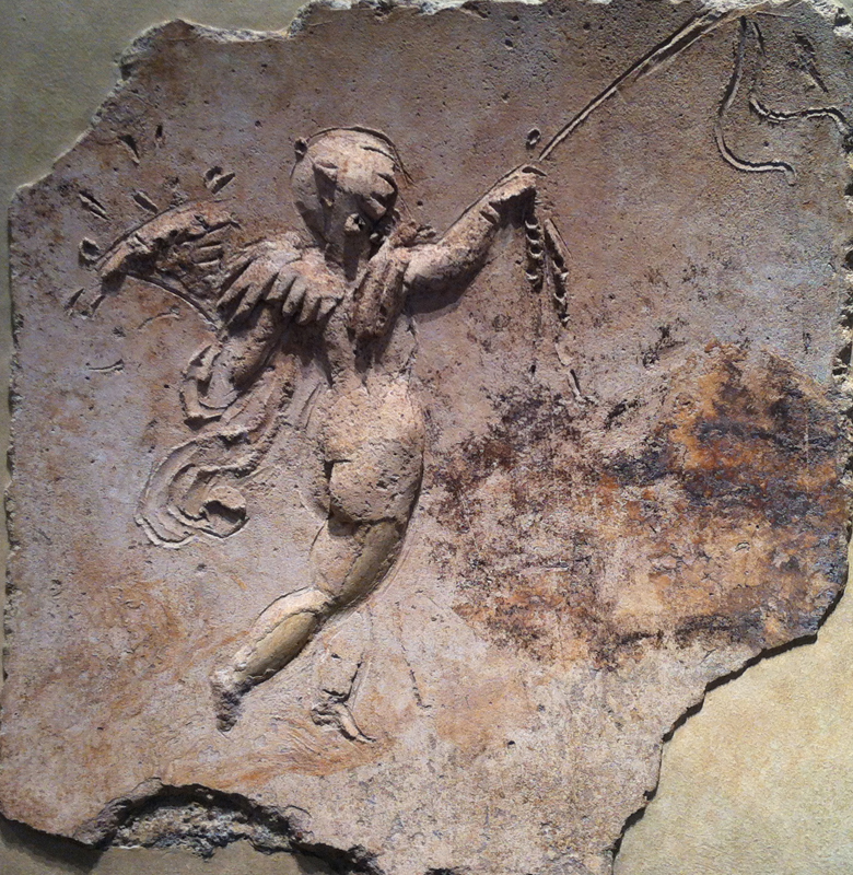 Eros, winging away in stucco relief. From a vaulted Roman ceiling of the latter half of the first century A.D. and now living at the Met.