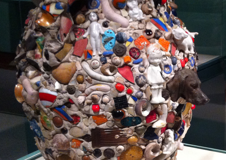 American Artist. Memory Jar, 20th Century. Hand-built clay with encrusted shards and found objects. High Museum, Atlanta, GA. Placed on the gravesite of a deceased person, memory jars have been built since the 1800's in the US and may derive from Kongo funerary rites.